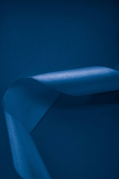 Abstract silk ribbon on royal blue background, exclusive luxury  - Zdjęcie, obraz