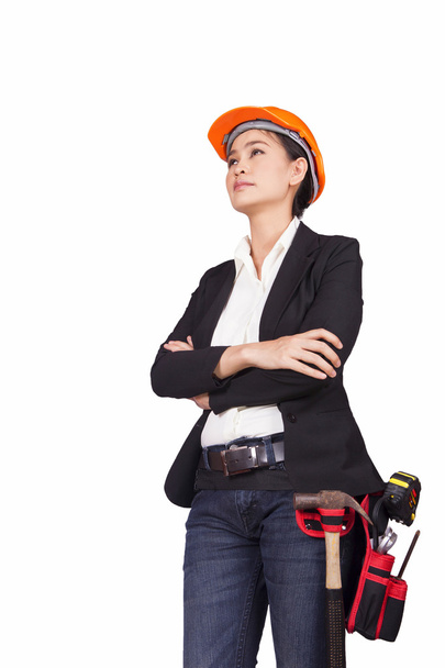 Жінка-інженер з інструментами перетинає руки над грудьми
 - Фото, зображення