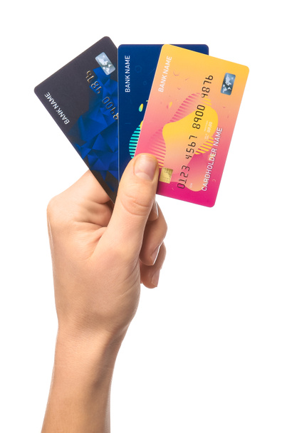 Vrouwelijke hand met creditcards op witte achtergrond - Foto, afbeelding