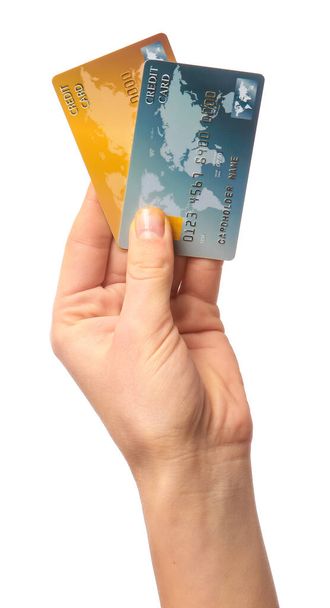 女性手でクレジットカードの上白い背景 - 写真・画像