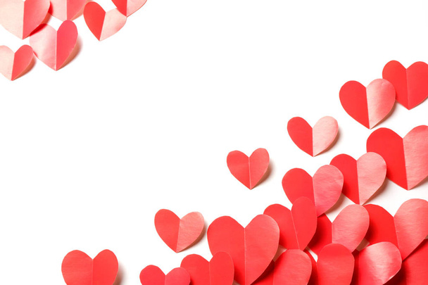 Cut out of red paper hearts on white background isolated. - Foto, imagen