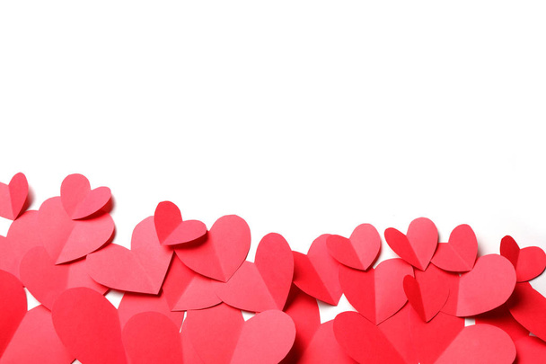 Cut out of red paper hearts on white background isolated. - Fotó, kép