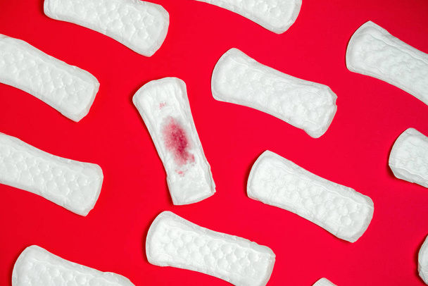 top view sanitary pads pattern  on a vibrant  red background - Photo, image