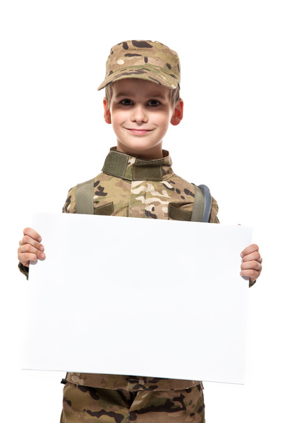 Young soldier holding a poster - 写真・画像