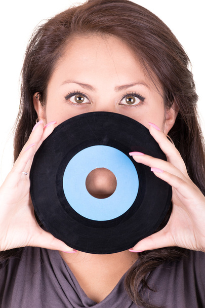 Beautiful girl holding a vinyl - on white background - Foto, immagini