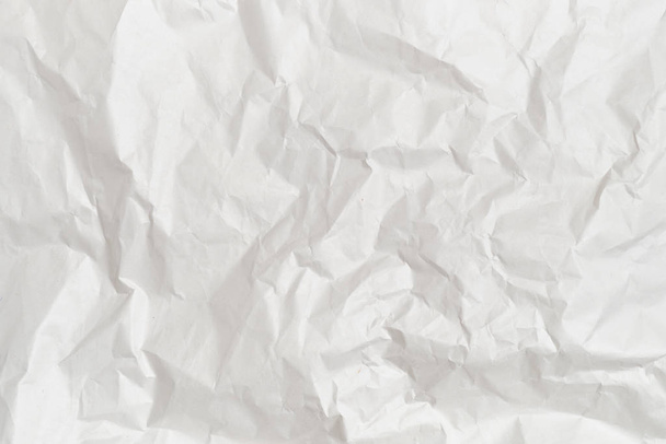 The background and texture of white crumpled paper. - Foto, immagini