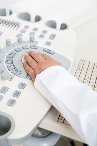 Gynecologist's Hand Using Ultrasound Machine - Фото, изображение