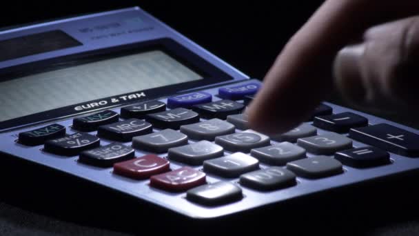 Calculating with a domestic calculator - Footage, Video