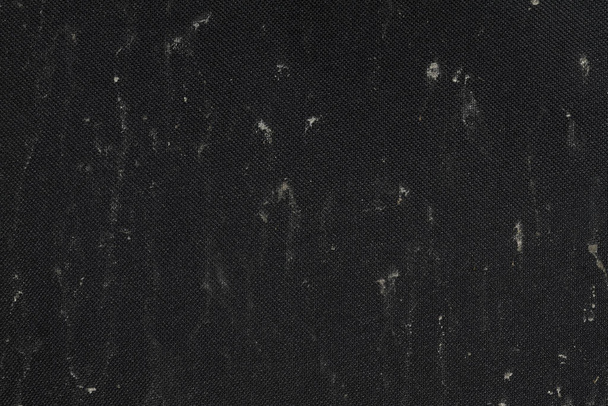 heavily soiled black textured surface as a background. - Fotografie, Obrázek