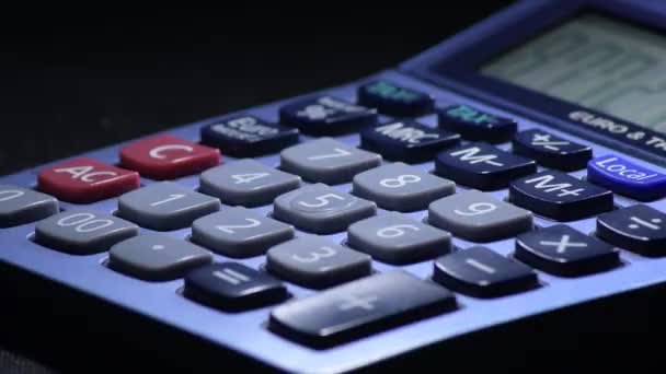 Calculating Costs with a domestic calculator - Footage, Video