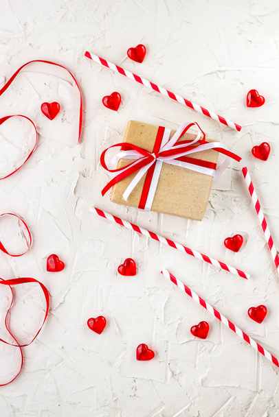 Flat lay for Valentine Day with red hearts, candles, confetti on white background. - Foto, imagen