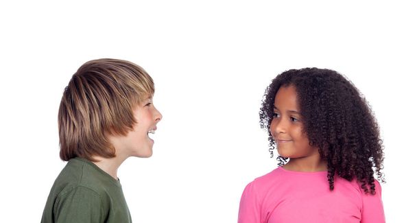 Boy talking with his friend, a beautiful african girl, isolated on a white background - Фото, изображение