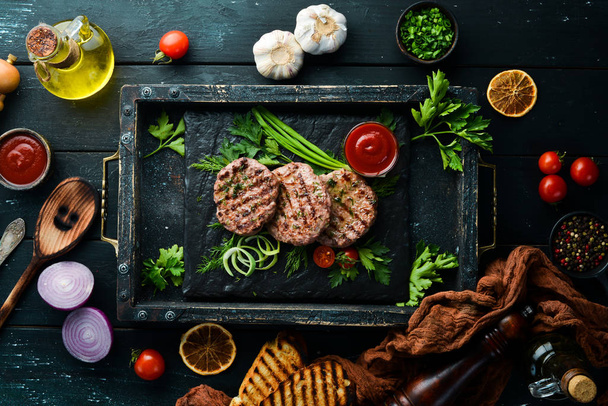 Grilled meat cutlets. Cutlets for burger. Top view. Free space for your text. - Zdjęcie, obraz