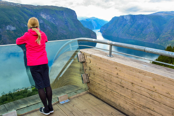 Girl on the Stegastein viewpoint in Norway. - Фото, изображение