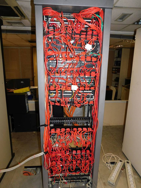 Computer network switch and cables in a computer room - Photo, Image