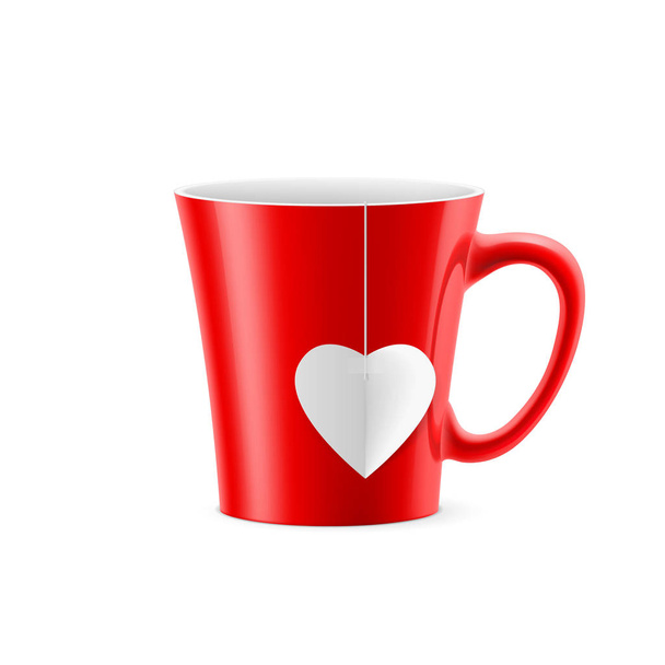 Red cup with tapered bottom with a tea bag in the form of heart - Фото, изображение