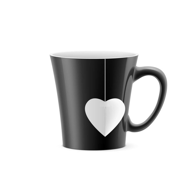 Black cup with tapered bottom with a tea bag in the form of heart - Fotoğraf, Görsel