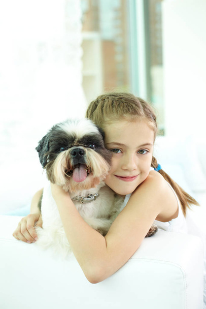 Portrait of happy girl and shih-tzu dog and looking at camera - Zdjęcie, obraz