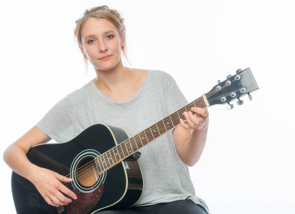 blond girl with a guitar - 写真・画像