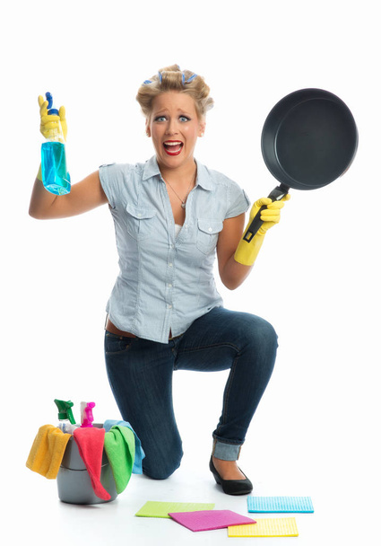 stressed housewife brushing skillet - Fotografie, Obrázek