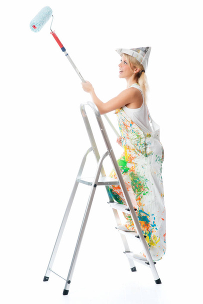 young woman with a brush on a white background - Foto, afbeelding