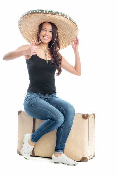 woman with suitcase and sombrero - Фото, изображение