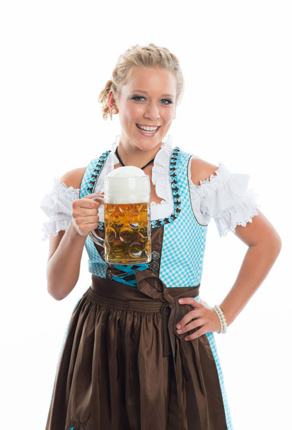 beautiful oktoberfest woman in dirndl holding beer mug - Fotó, kép