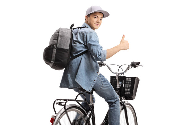 Guy riding a bicycle and holding his thumb up - Photo, Image