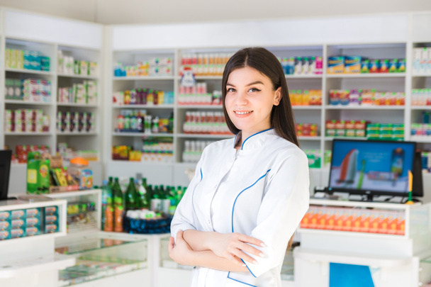 smart and confident woman pharmacist smiling. the face of the drug store - Photo, Image