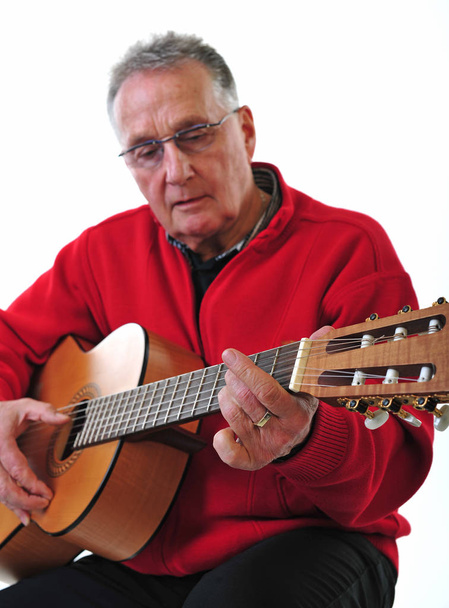 sprightly pensioner playing guitar - Fotó, kép