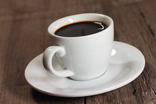 cup of coffee on wooden table - Valokuva, kuva