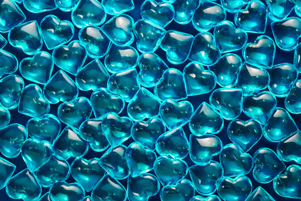 Valentines day background. Blue backdrop made of glass hearts. LGBT love symbol - Foto, afbeelding