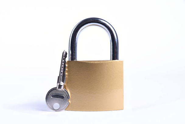 Locked Golden Padlock with keys on the white background. - Photo, Image
