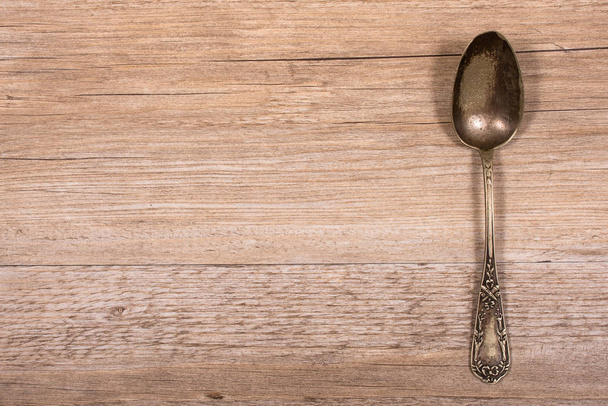 age spoons from silver on a wooden table - Photo, Image