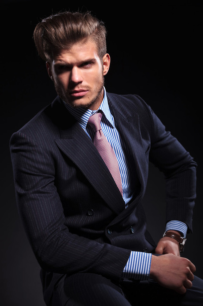 young business man is seated and looking away - Foto, Imagem