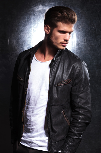 serious young fashion model in leather jacket - Photo, Image