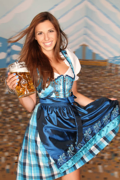 woman in dirndl with beer - Foto, imagen