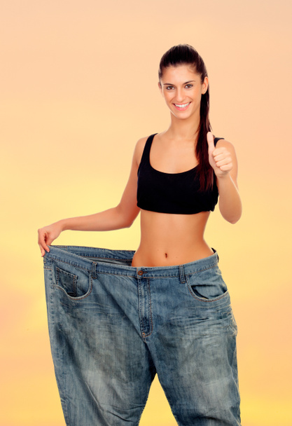 Slim woman with huge pants - Фото, зображення