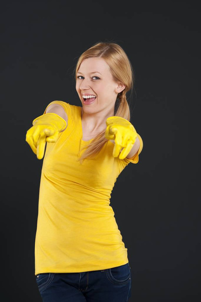 Female cleaner pointing fingers on you - Valokuva, kuva