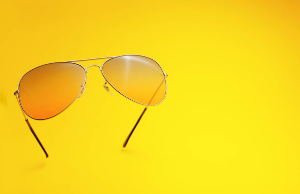 Stylish sunglasses on color background - Фото, изображение