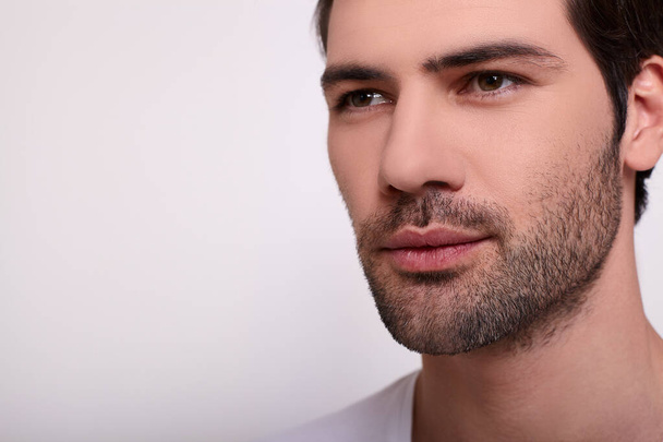 Close-up, sexy young male face of a white guy. - 写真・画像