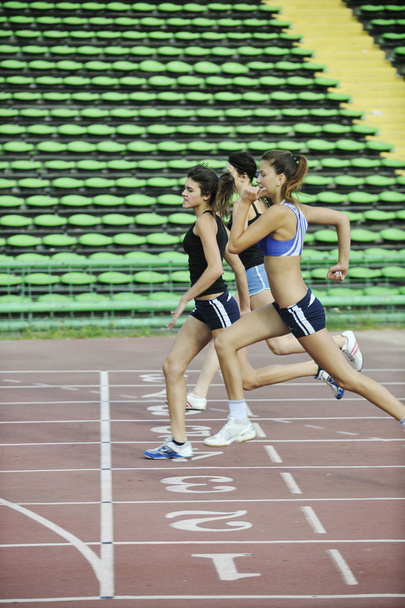 Girls running on athletics race track - Foto, Imagem