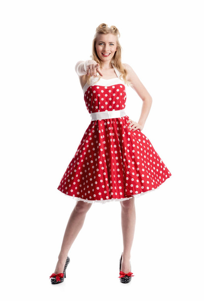 a woman in the polka dot dress gestikulliert with hands - 写真・画像