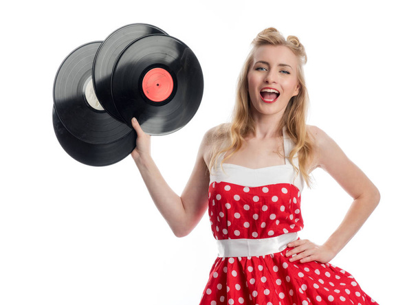 a woman in rockabilly style keeps platter as advertising space - Foto, immagini