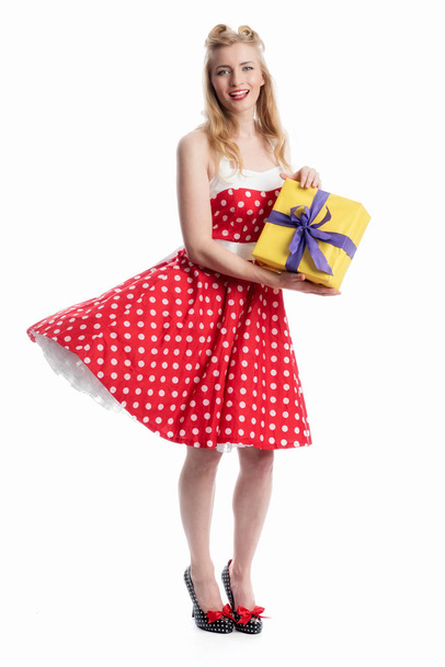 a girl with gifts wearing a rockabilly dress - Zdjęcie, obraz