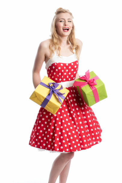 a girl with gifts wearing a rockabilly dress - Foto, Imagen
