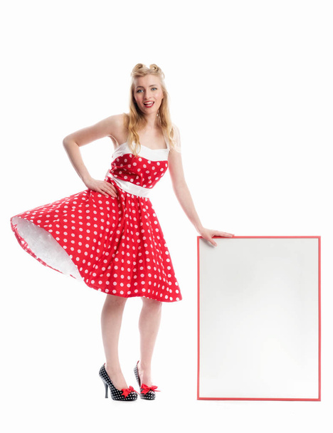 a woman in rockabilly style holds an advertising sign - Foto, Imagem