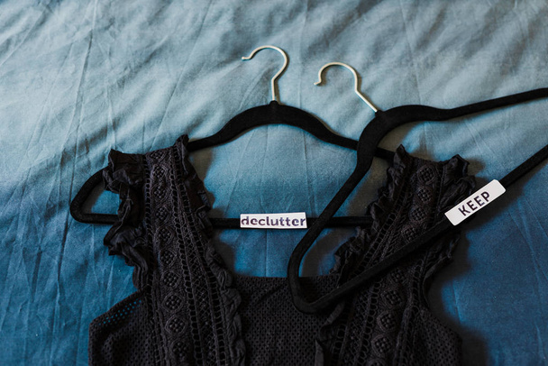 clothes hangers with black top and text labels to sort between i - Photo, Image