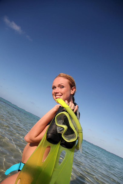 Woman getting out of water after snorkeling journey - Foto, Imagem