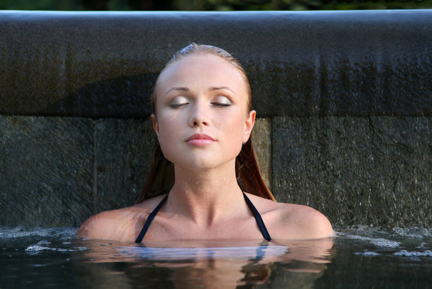 Portrait of beautiful woman in water - Photo, image